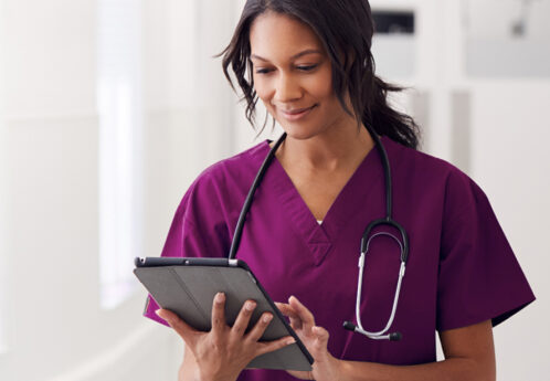 female medical staff using tablet
